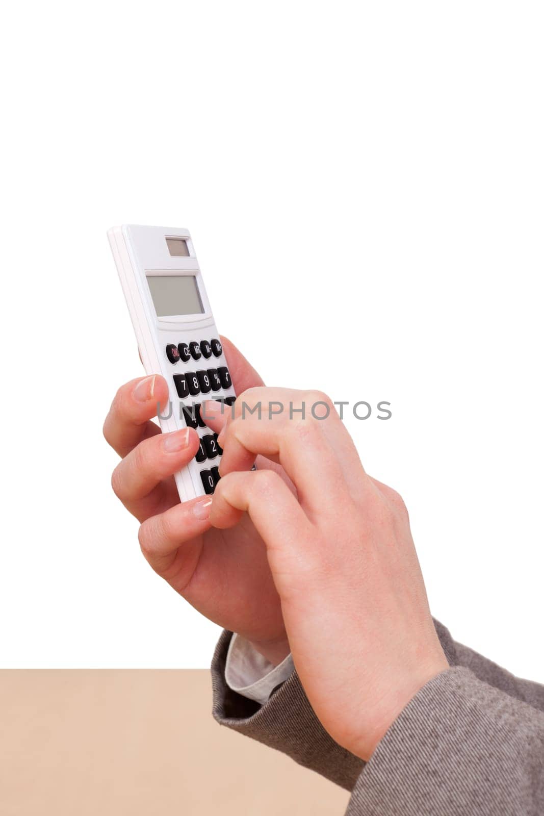 Woman's hand operating a calculator