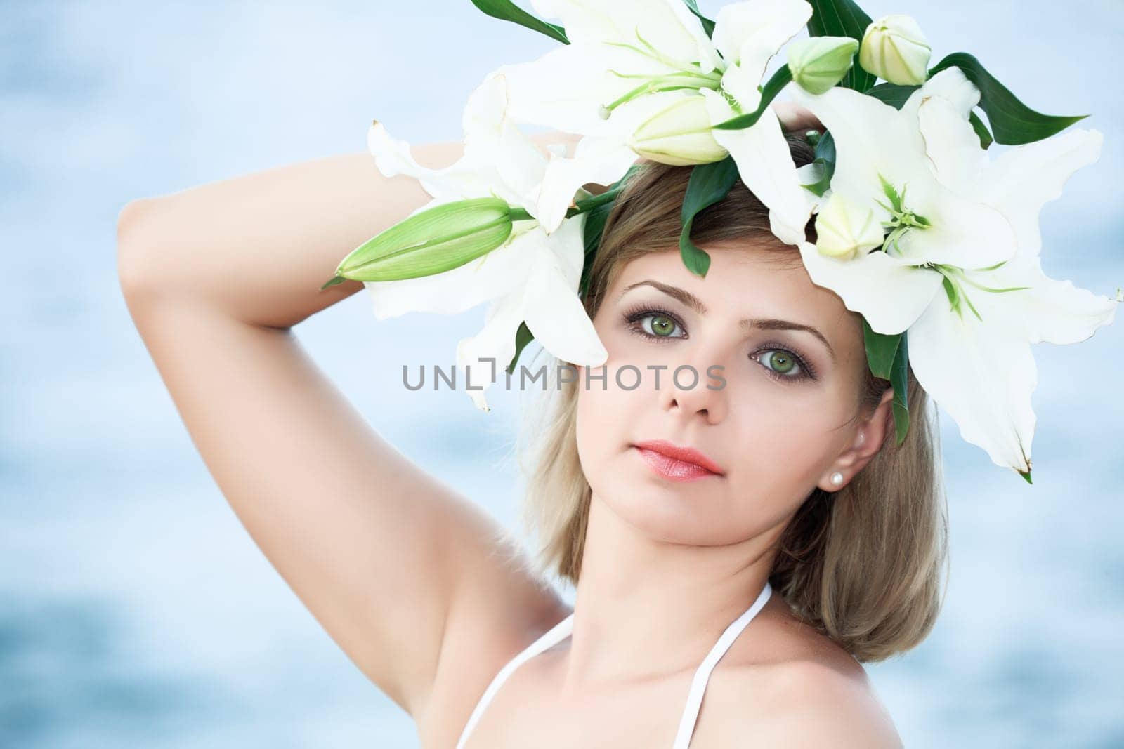 Portrait of a young beautiful woman in wreath