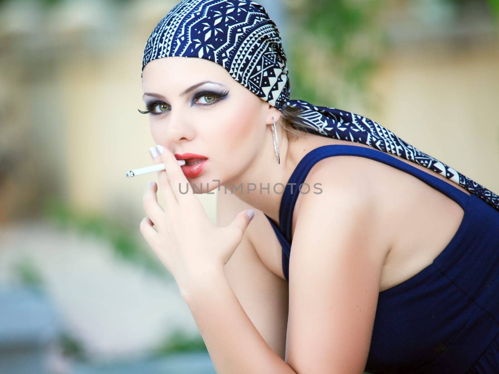 Young beautiful smoking woman.