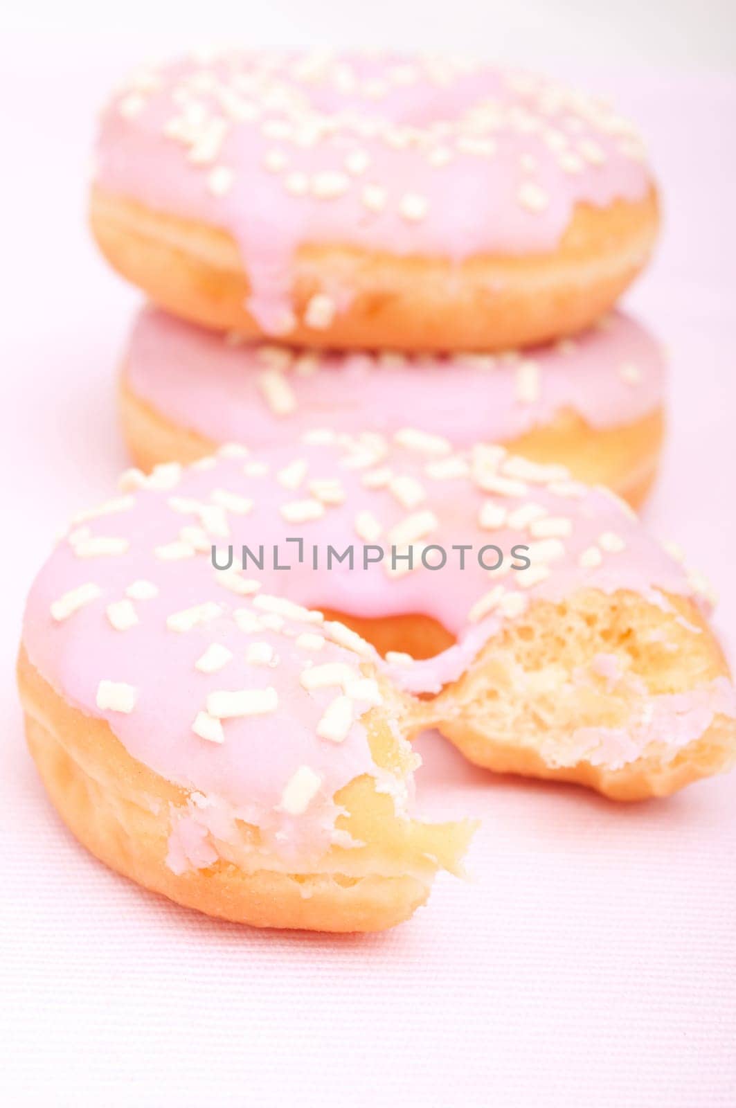 Closeup of Homemade Donuts with Pink Icing - Shallow Depth of Field