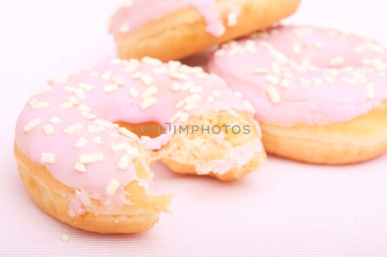 Closeup of Homemade Donuts with Pink Icing - Shallow Depth of Field