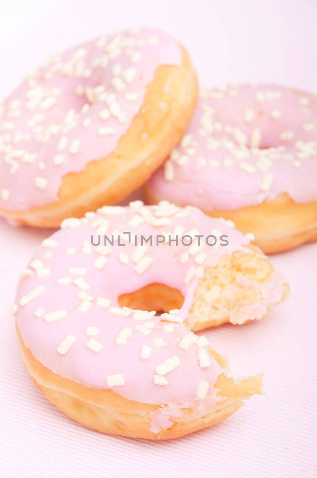 Closeup of Homemade Donuts with Pink Icing - Shallow Depth of Field