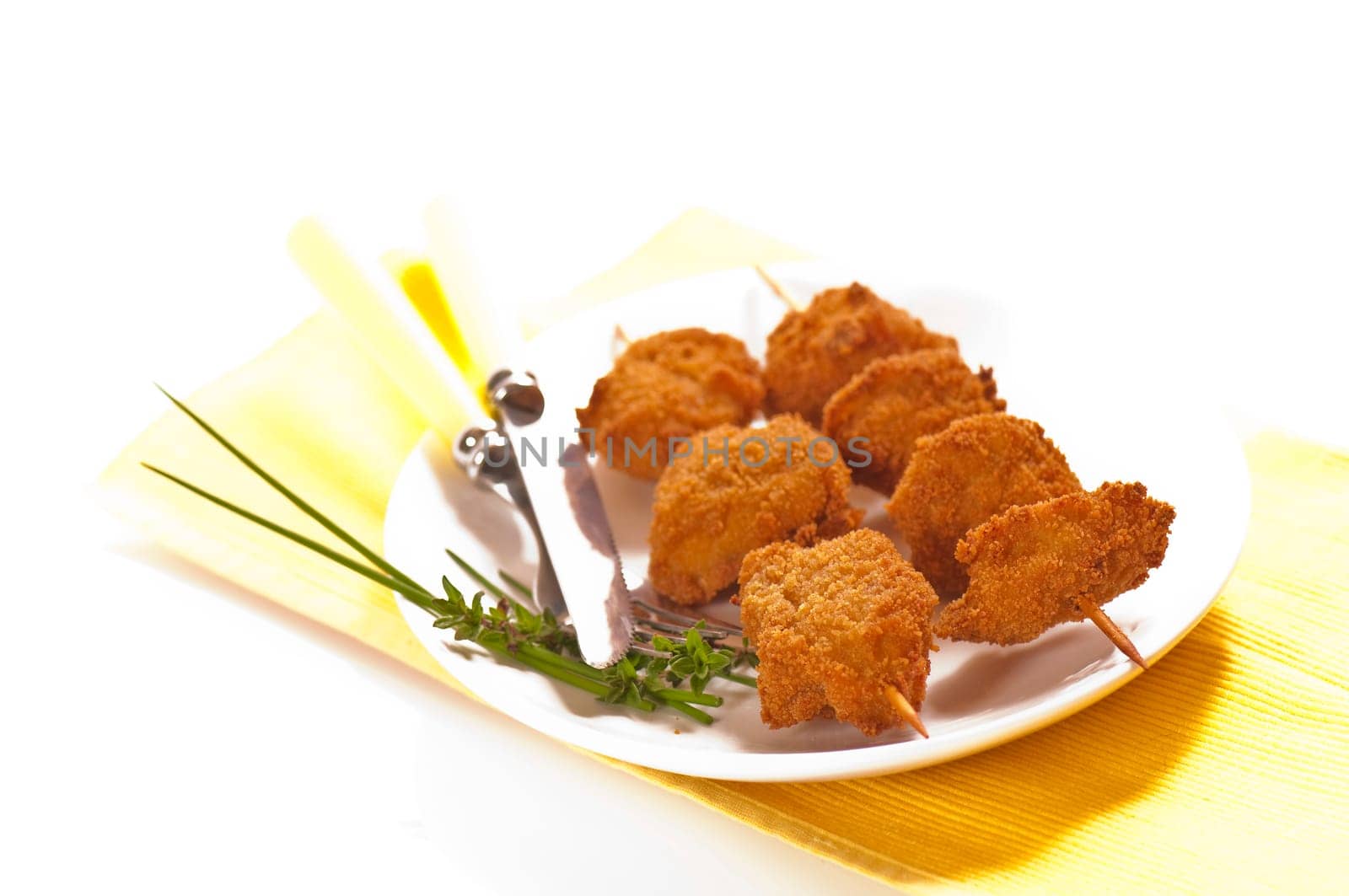 deep-fried chicken breast on a skewer