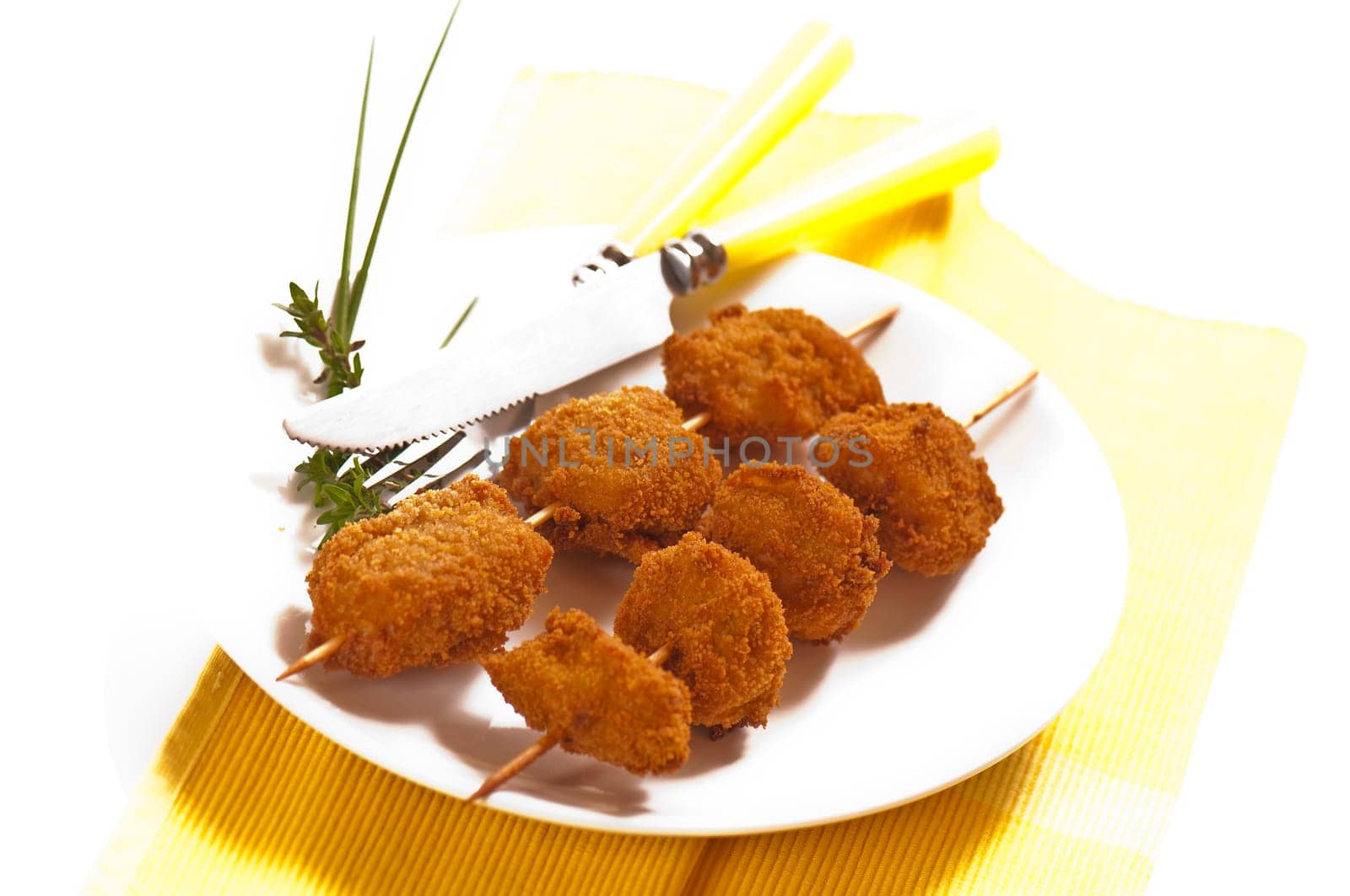 deep-fried chicken breast on a skewer