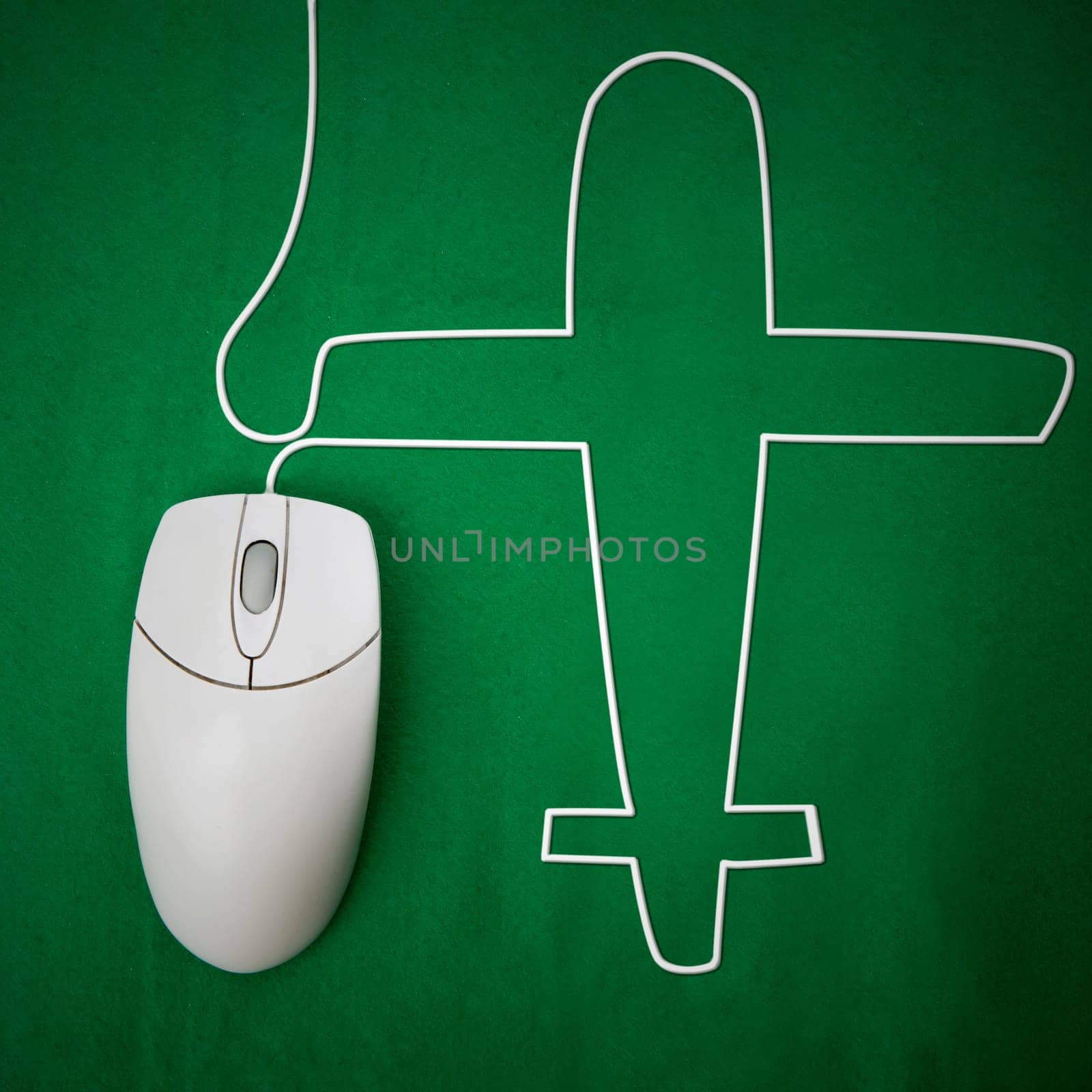 An computer mouse and airplane concept - booking a flight online