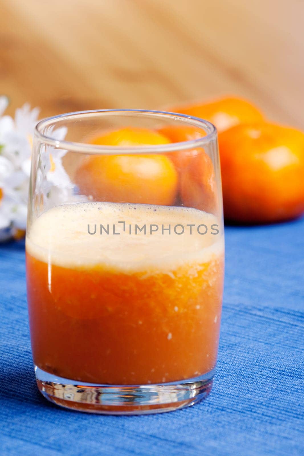 A fresh orange smoothie made with fresh fruit