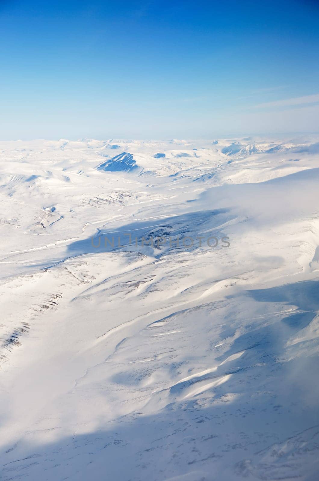 A snow covered mountain landscape - Spitsbergen, Svalbard Norway