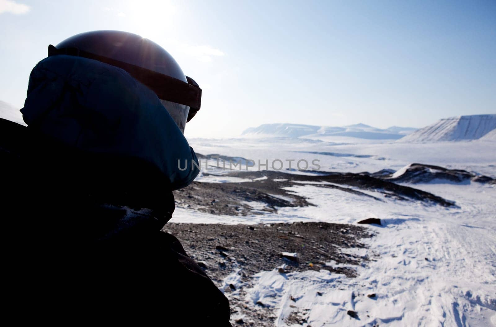 A winter adventure guide on a barren winter landscape
