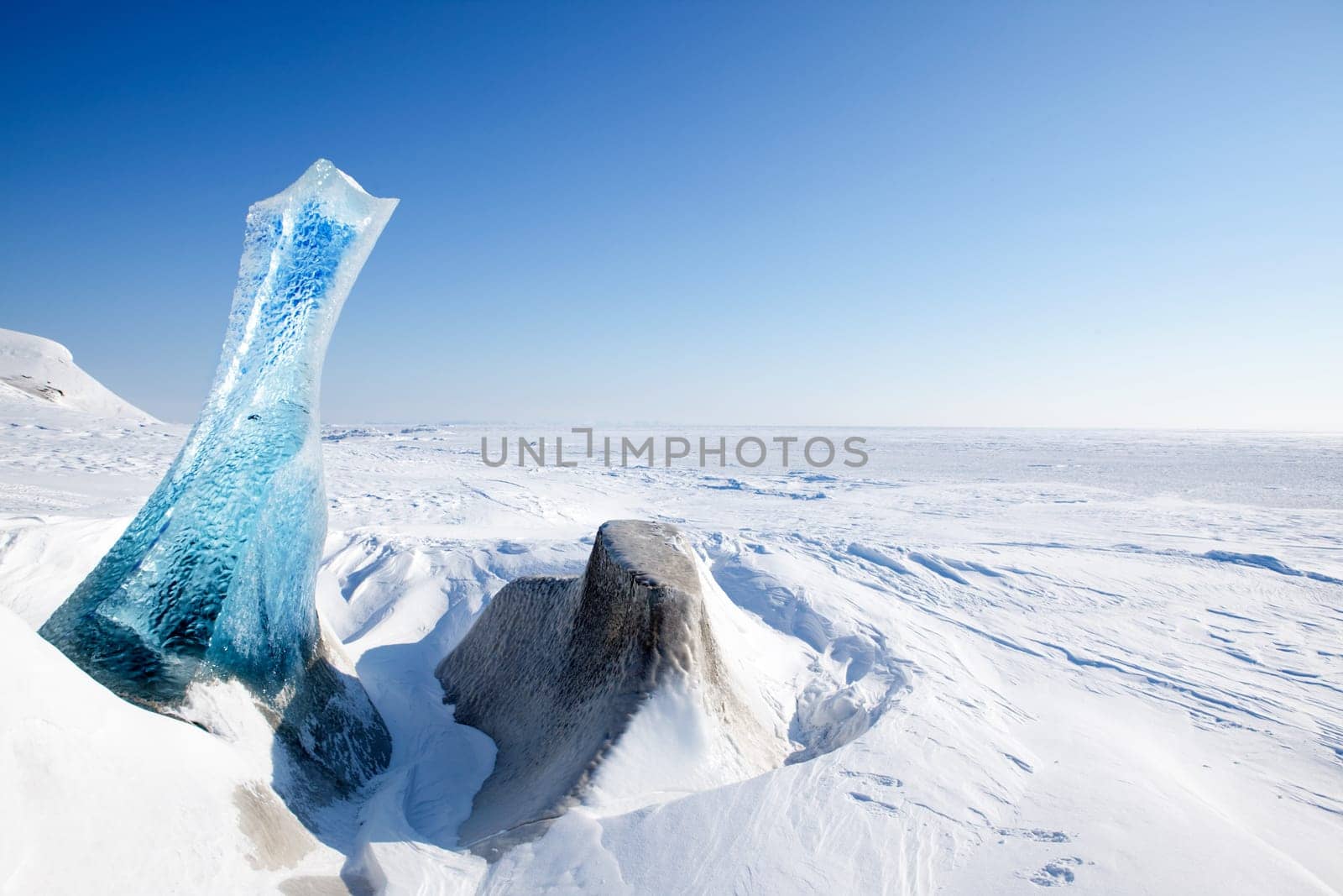 A piece of glacial ice sticking out of the frozen ocean, Spitsbergen, Svalbard, Norway