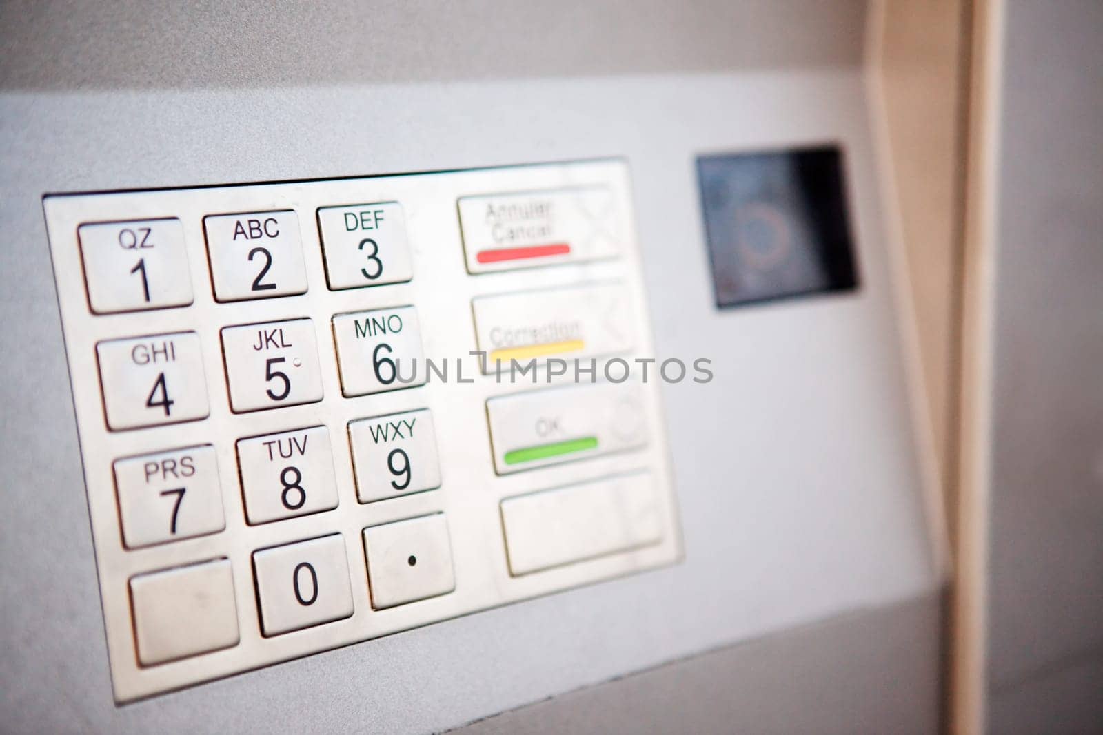 A close up detail of an outdoor bank machine  shallow depth of field with critical focus on middle row of numbers