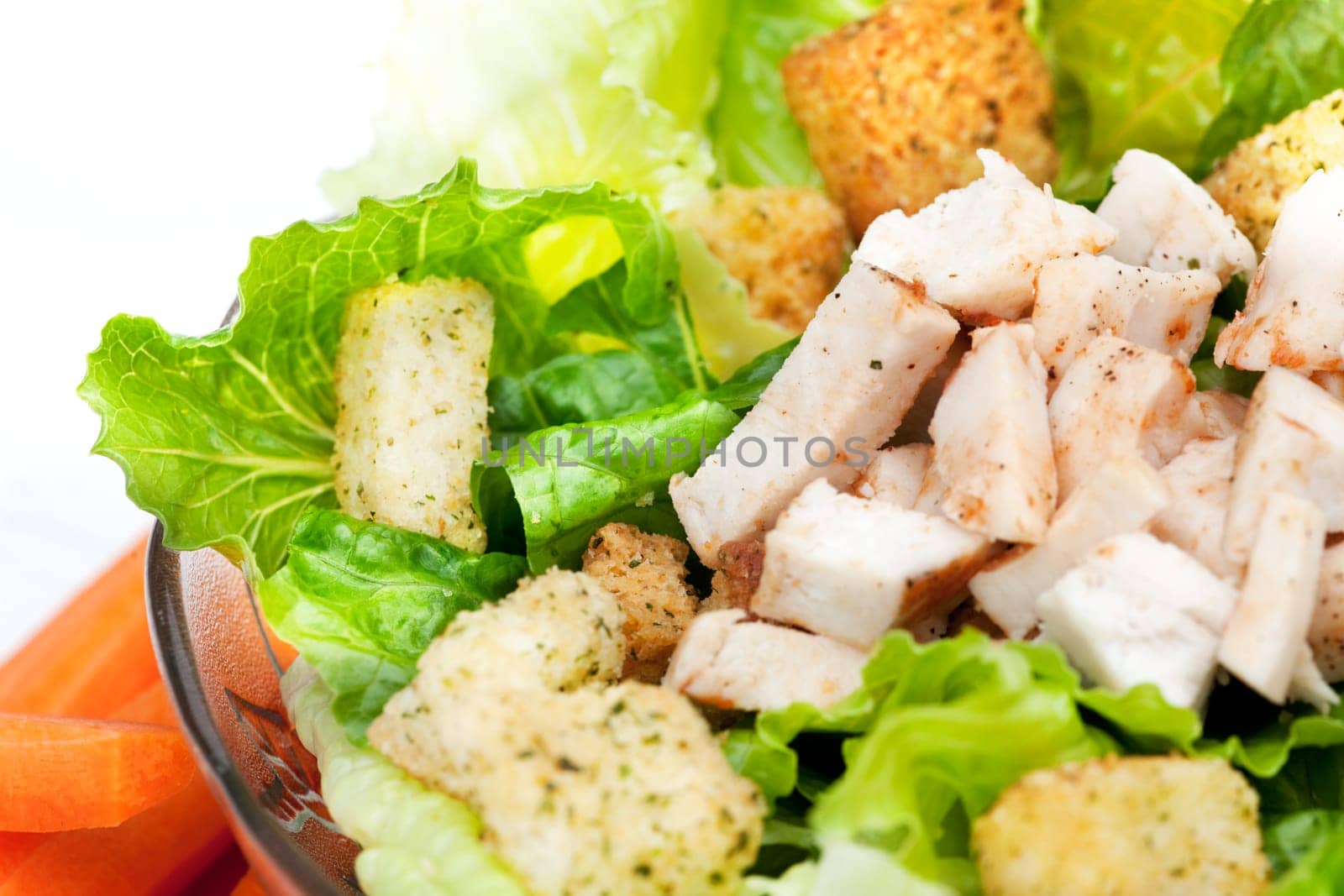 A chicken caesar salad detail