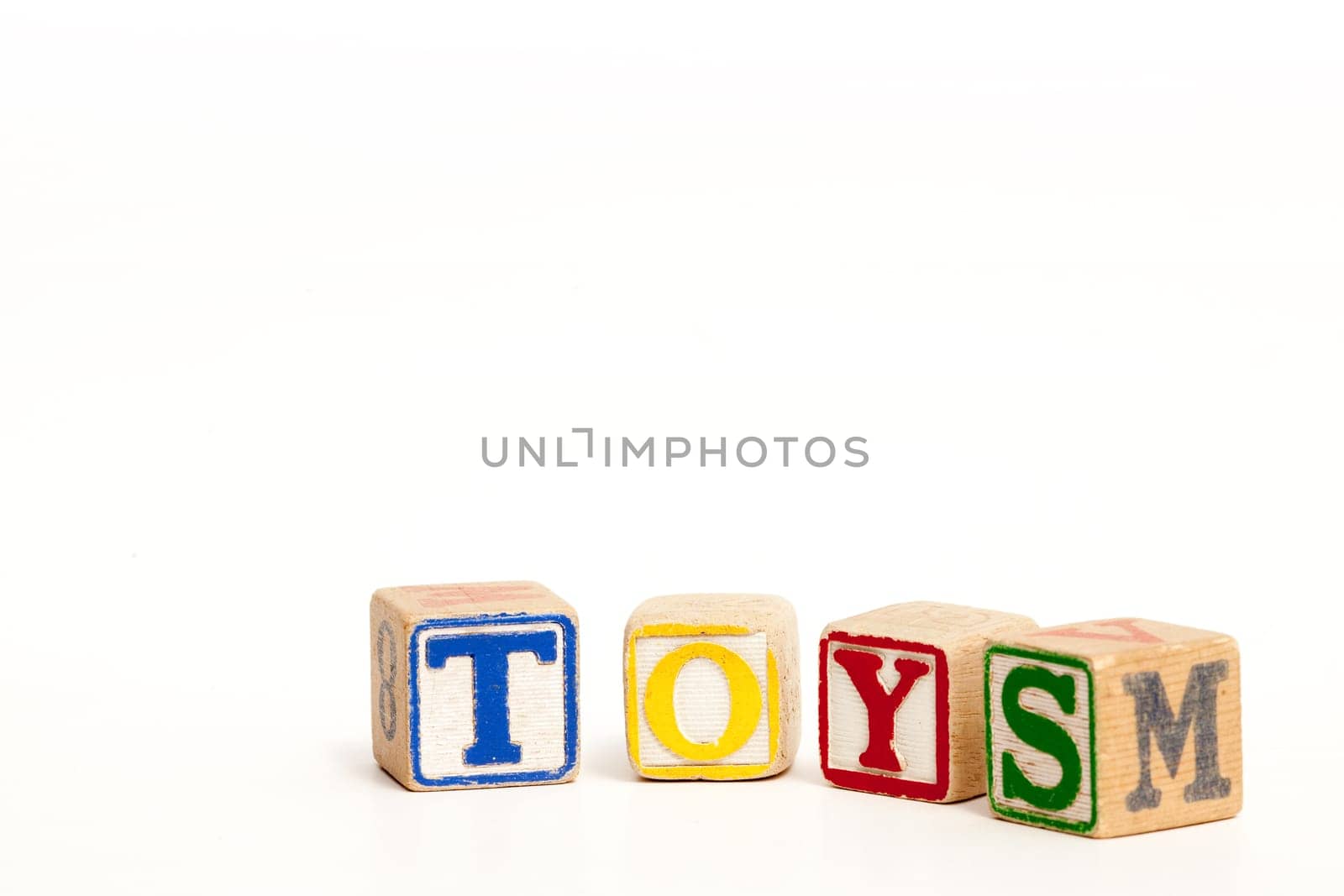 Toy blocks isolated on white spelling the word toys