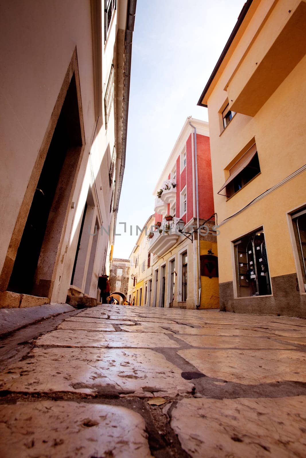 A small pretty street wtih cobblestone in Rab, Croatia