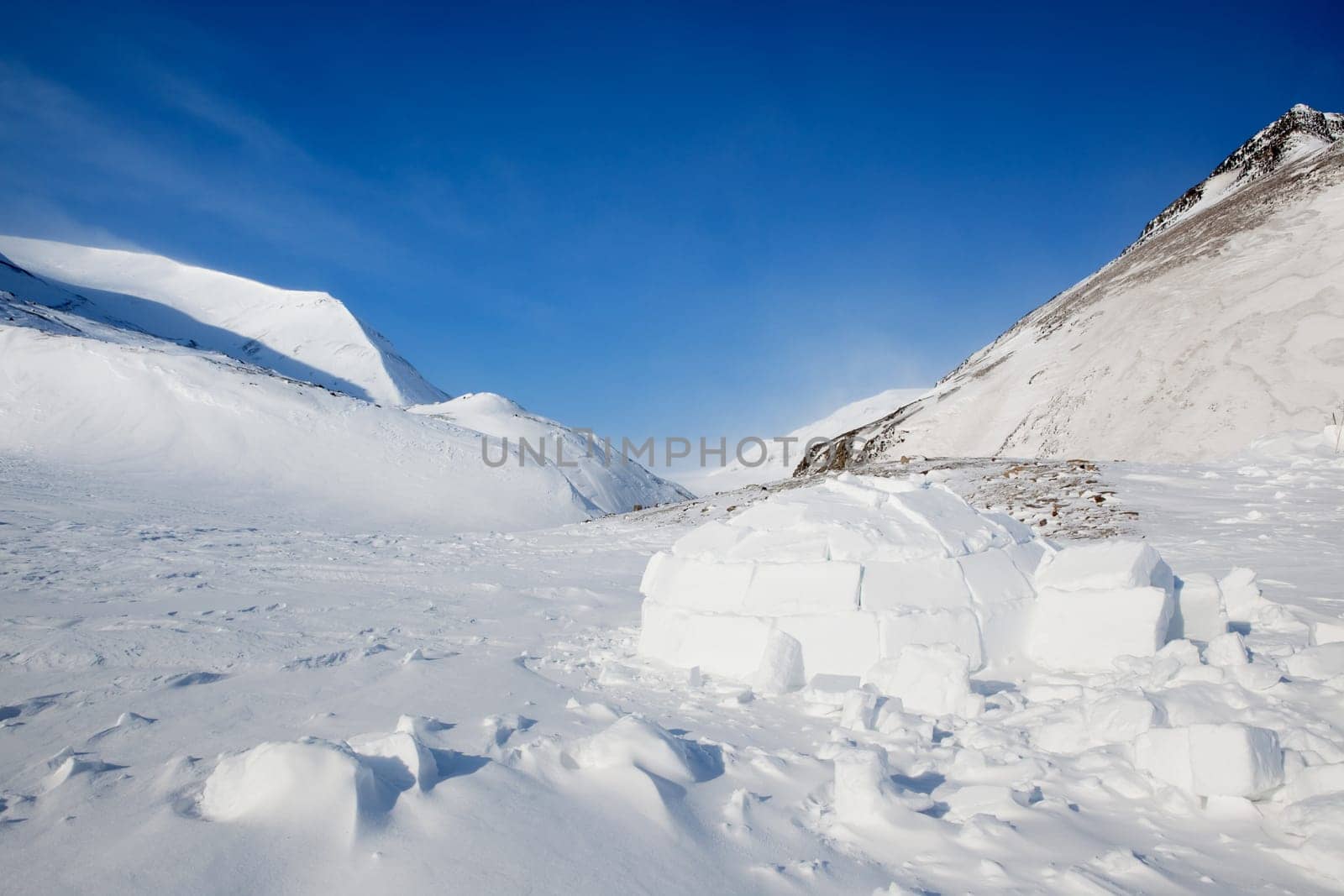 Igloo in a winter mountain setting