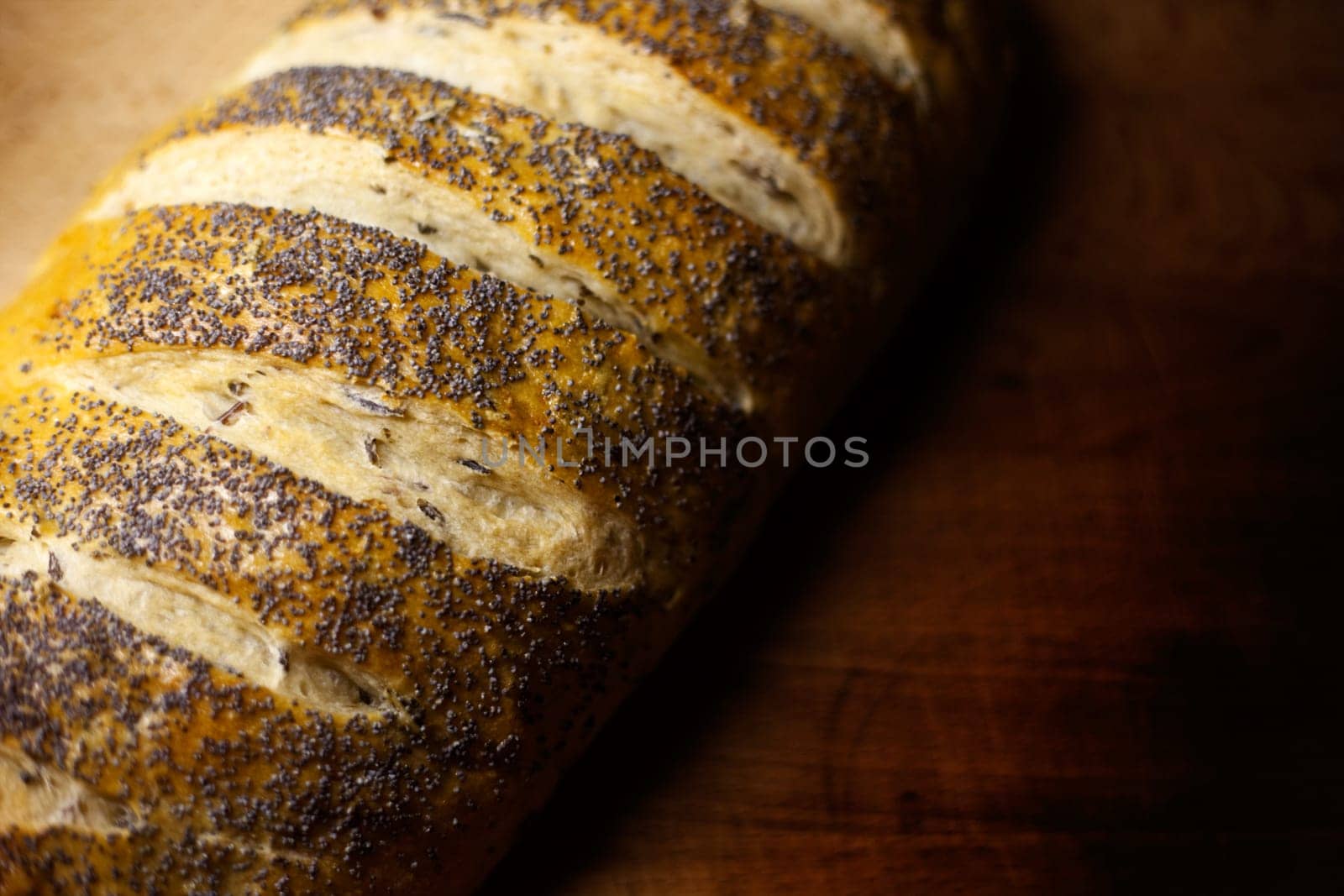 Fresh home-made onion and wild rice bread garnished with poppy seeds with copy space