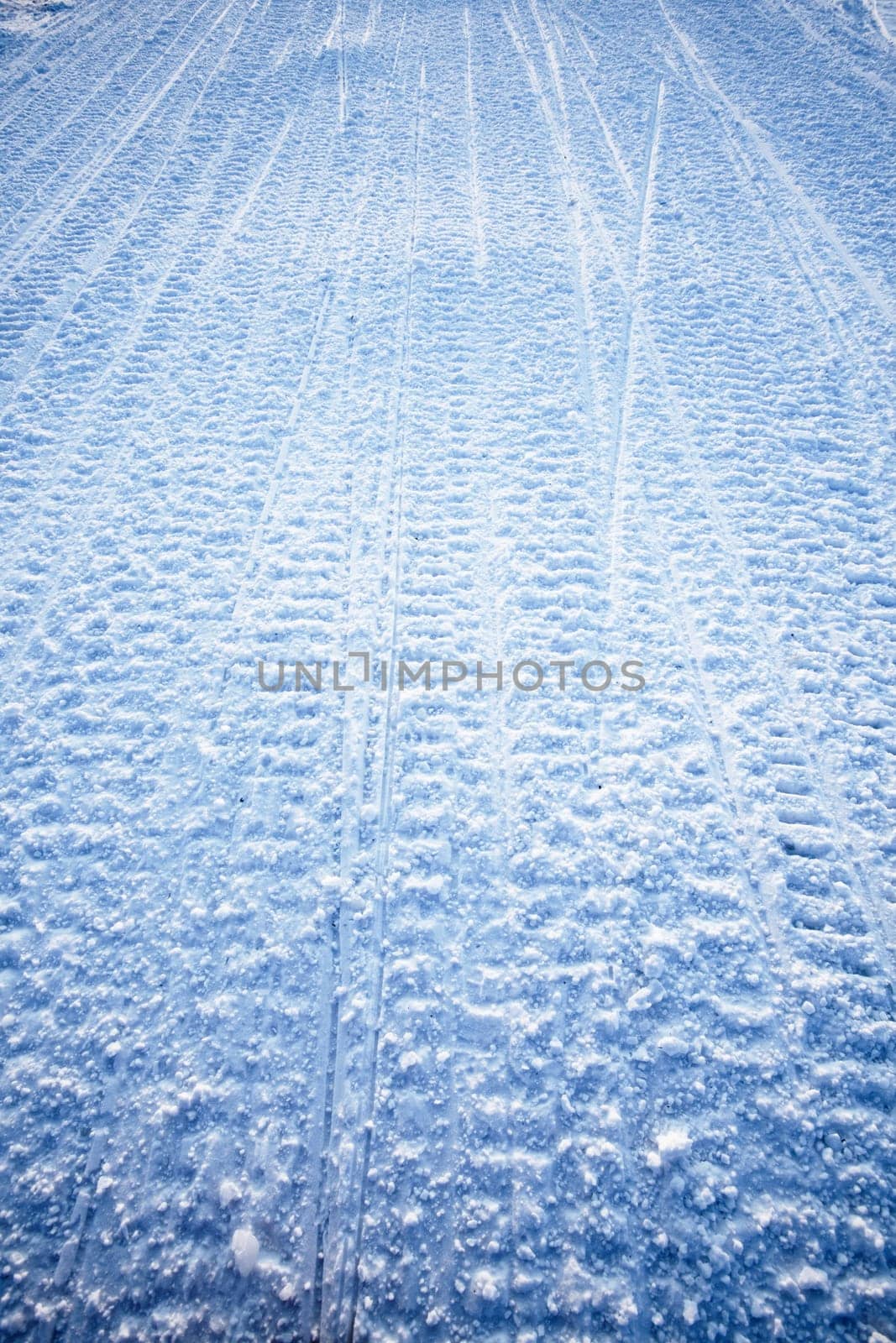 Snow texture background from snowmobile tracks