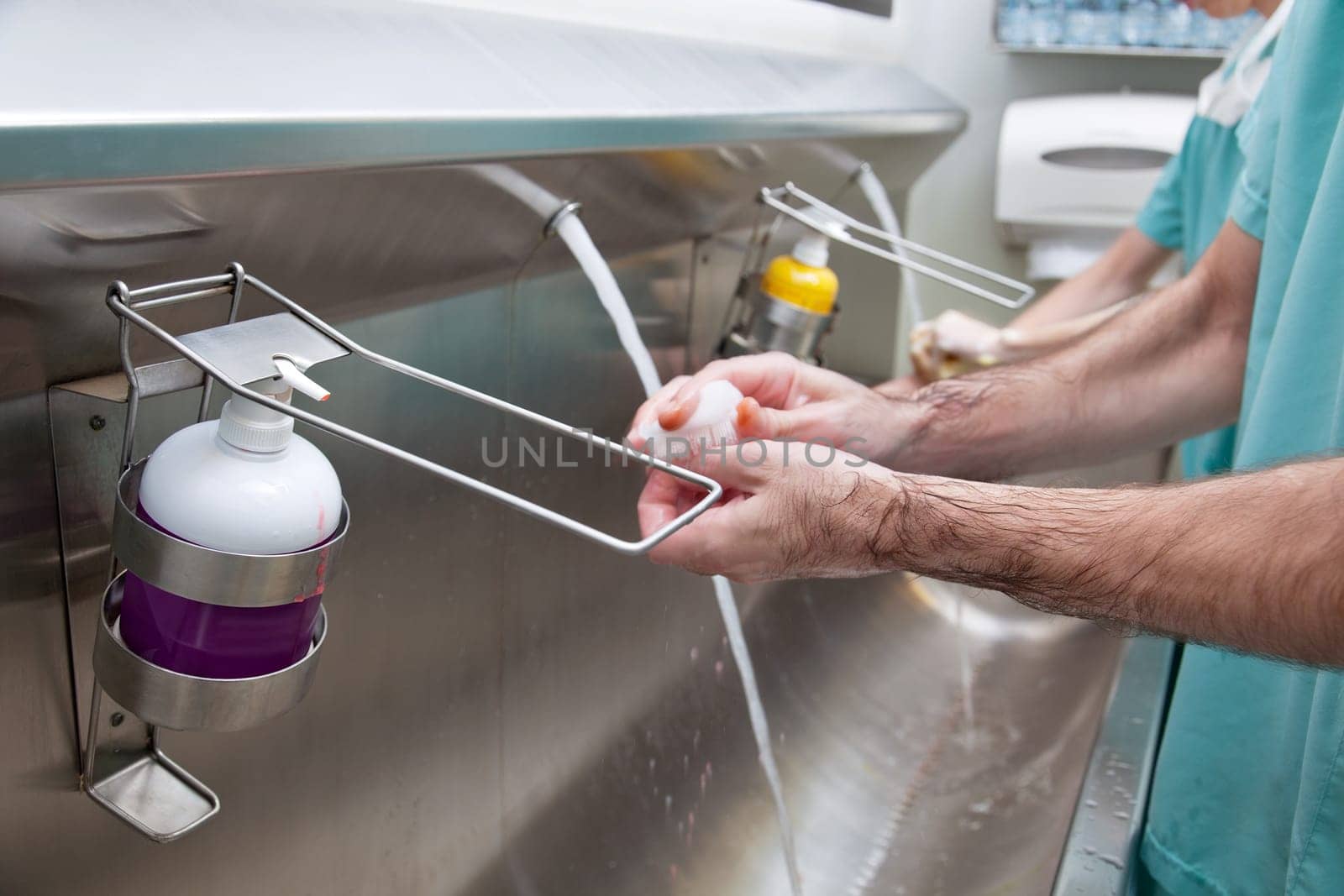 Close-up of doctors washing hands