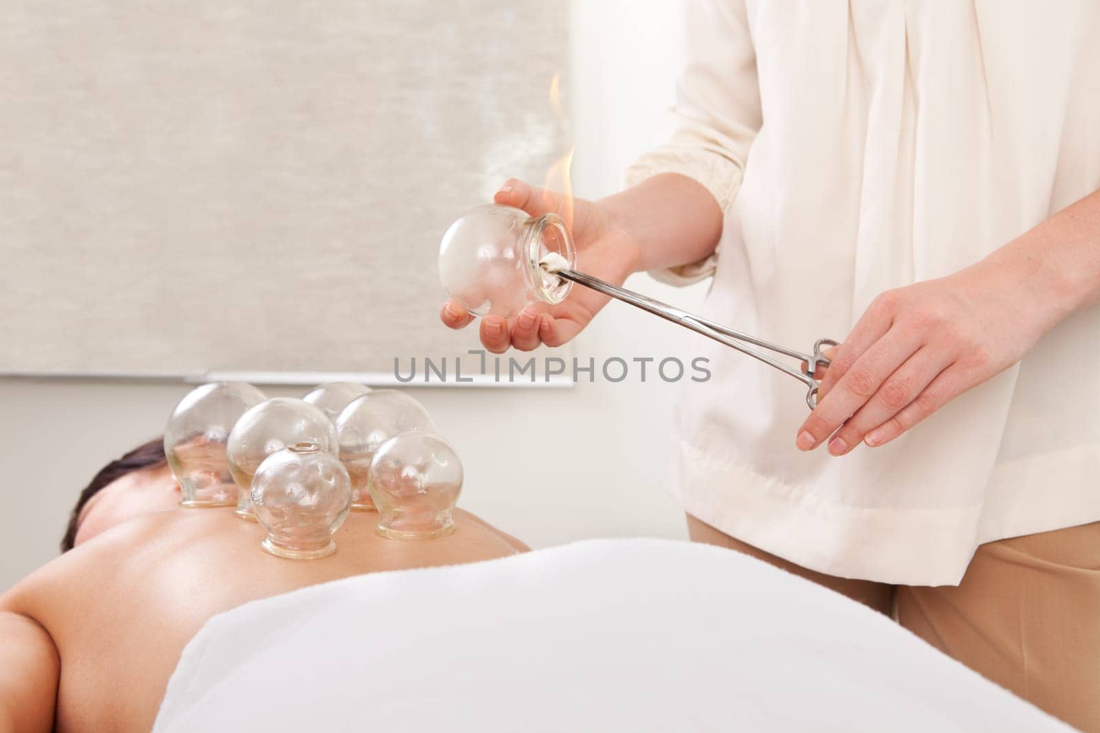 Detail of a flame heating up a fire cupping glass