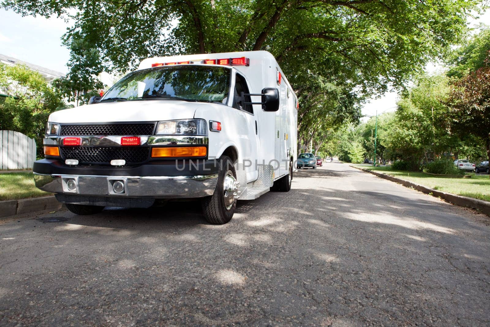 3/4 view of an ambulance parked in a residential area of a city