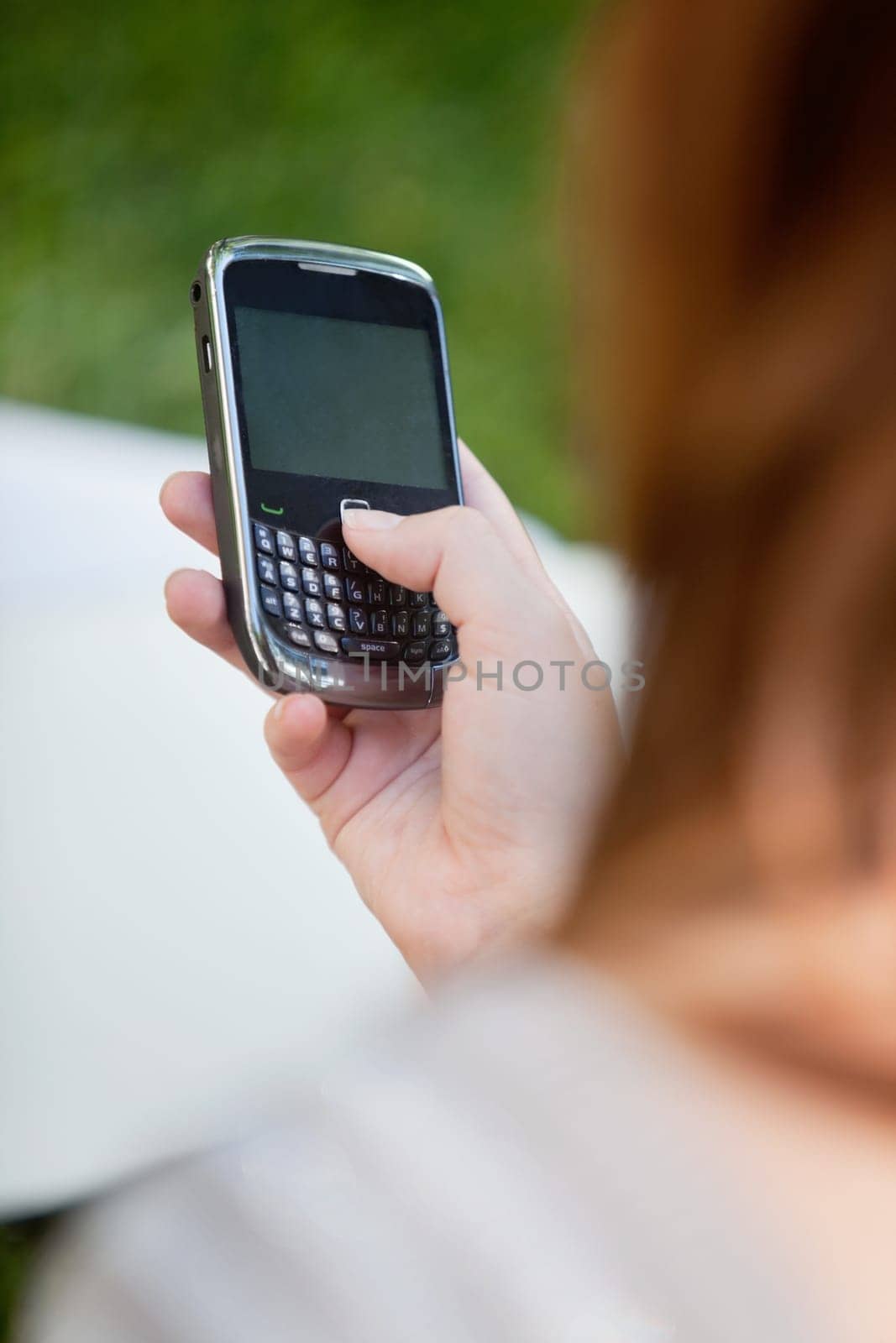 Close-up of girl's hand holding cell phone