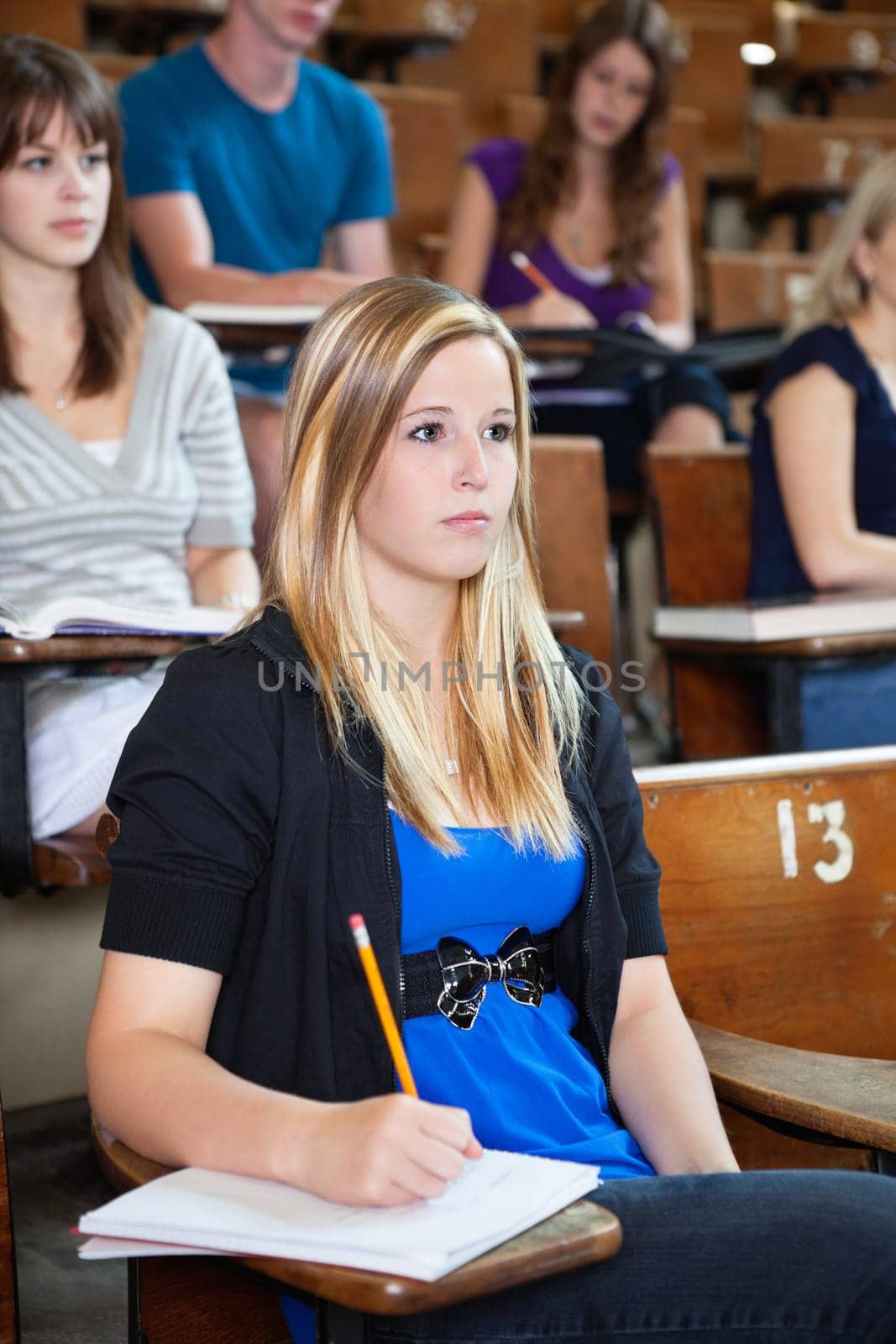 Students paying attention in lecture at seminar hall