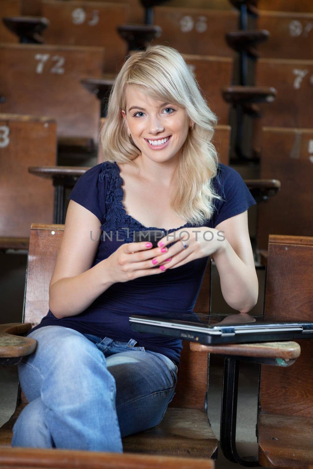 Portrait of smiling girl using cell phone