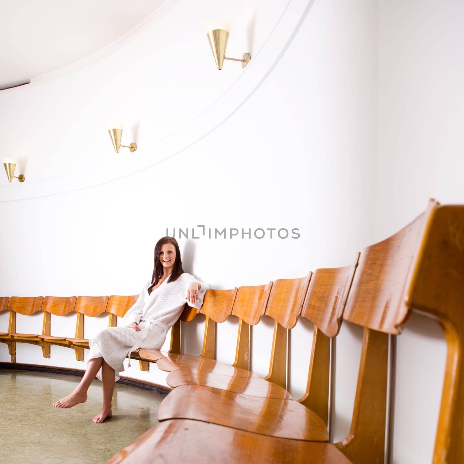 A young female in a spa waiting area