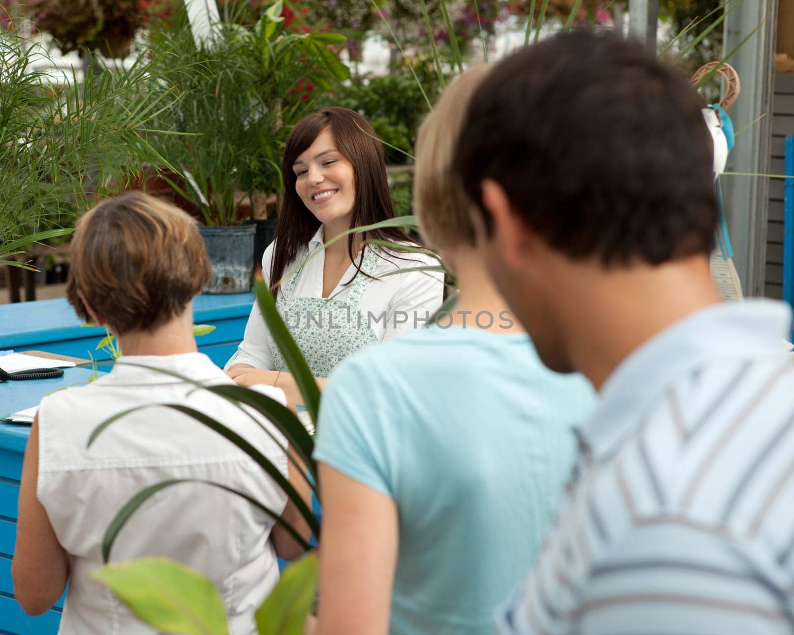 Customers at check-out counter in garden center