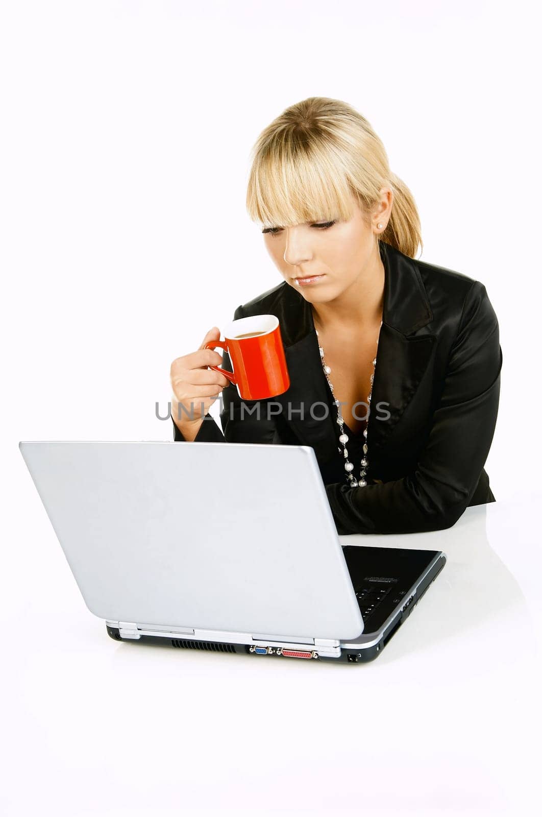 Sexy Beautiful Business women with laptop computer and coffee cup isolated on white