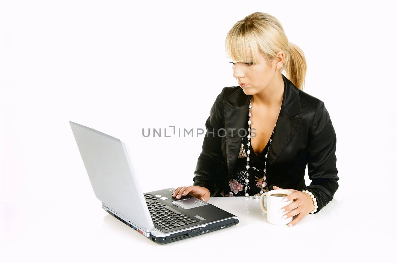 Sexy Beautiful Business women with laptop computer and coffee cup isolated on white