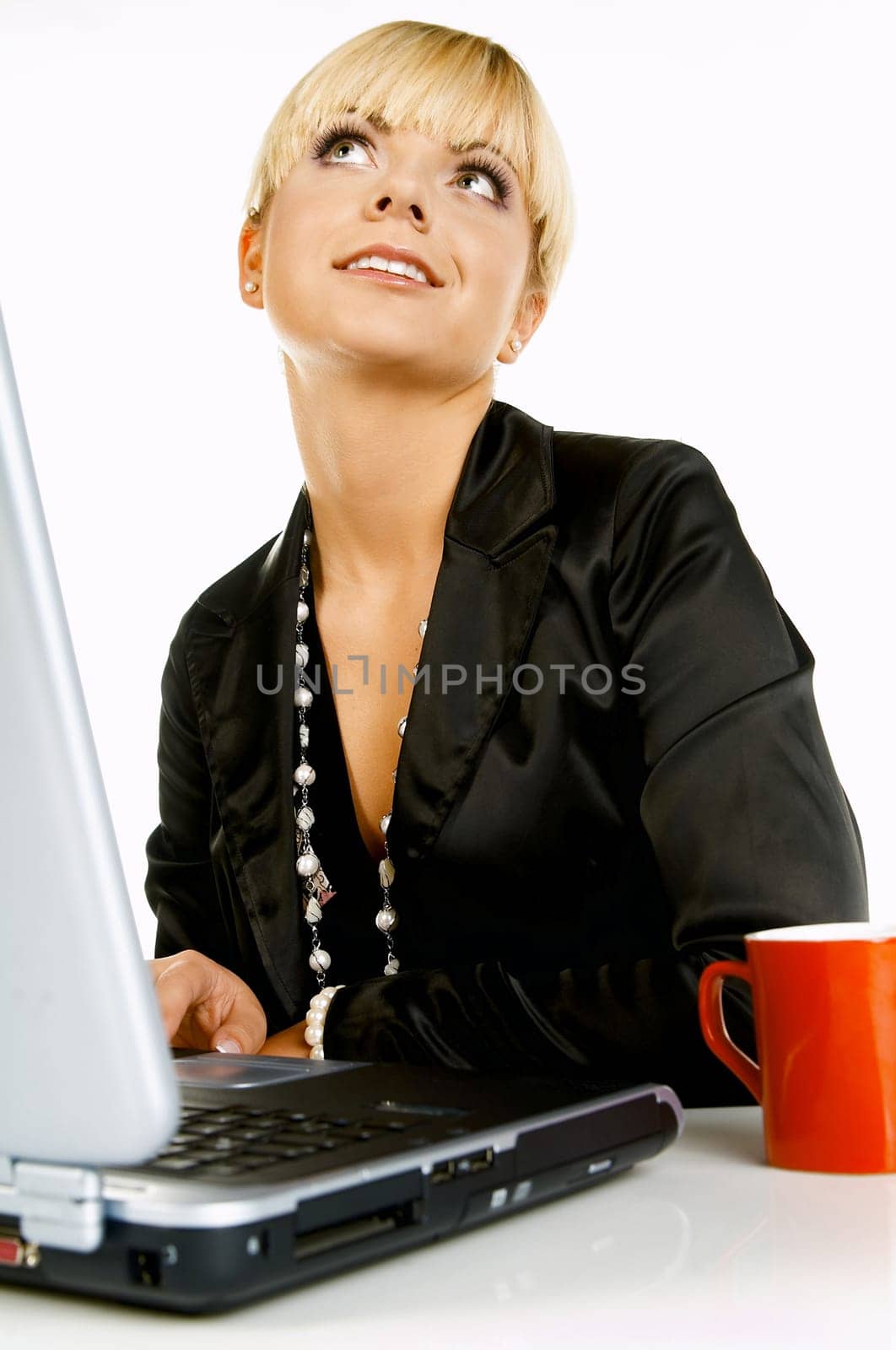 Sexy Beautiful Business women with laptop computer and coffee cup isolated on white