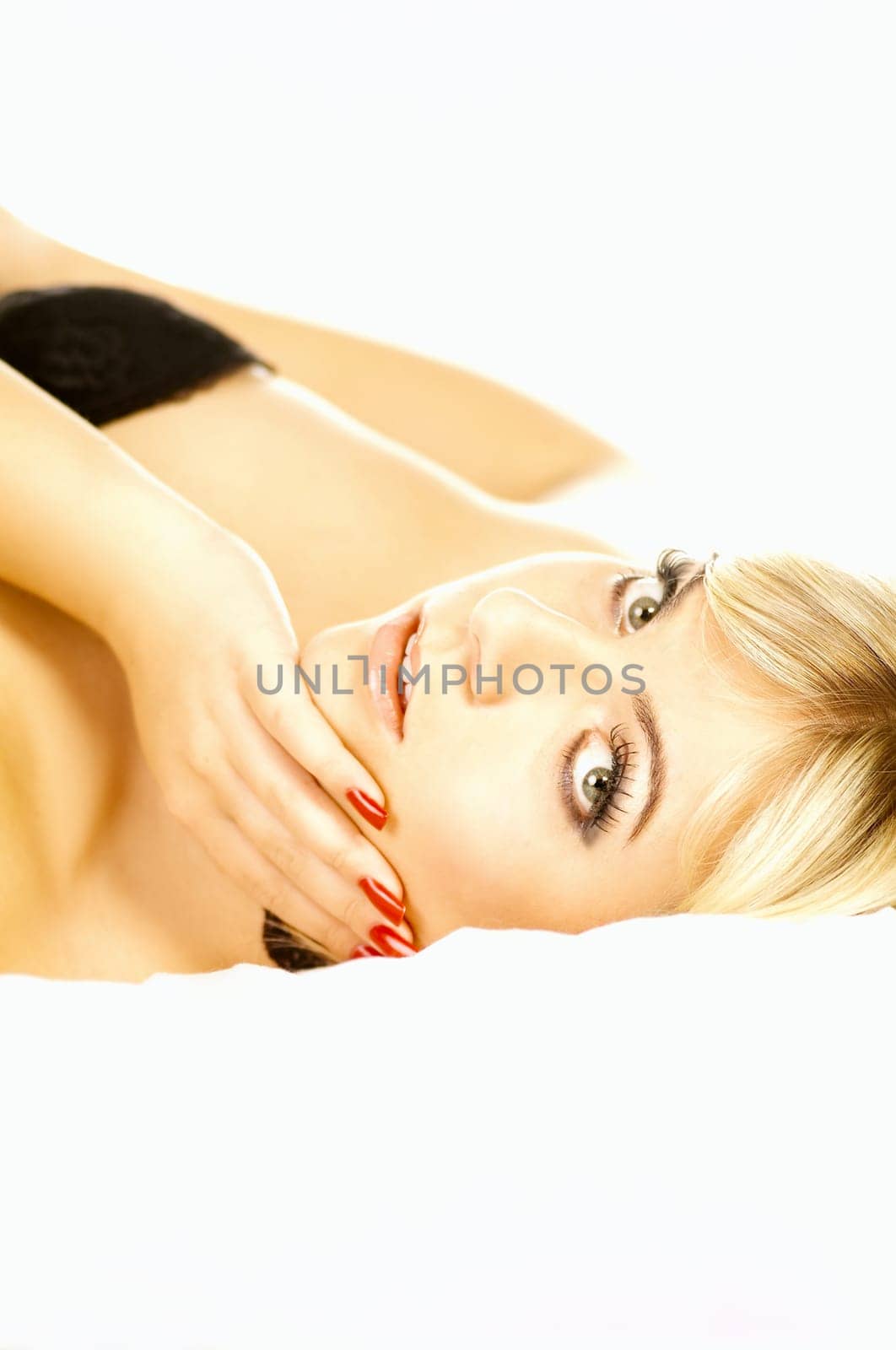Portrait of attractive beautiful young woman on bed
