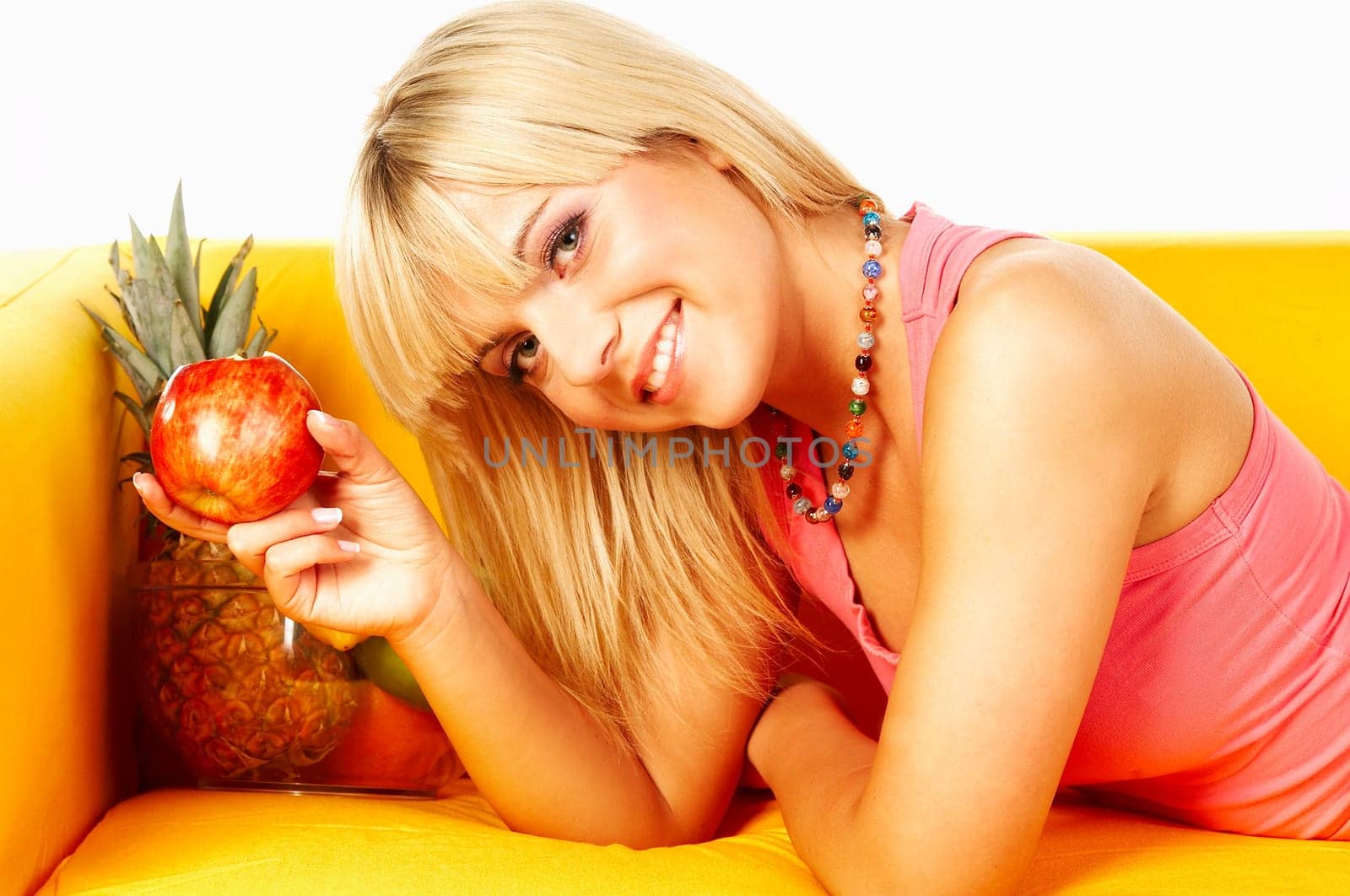 Happy beautiful women with fresh fruits