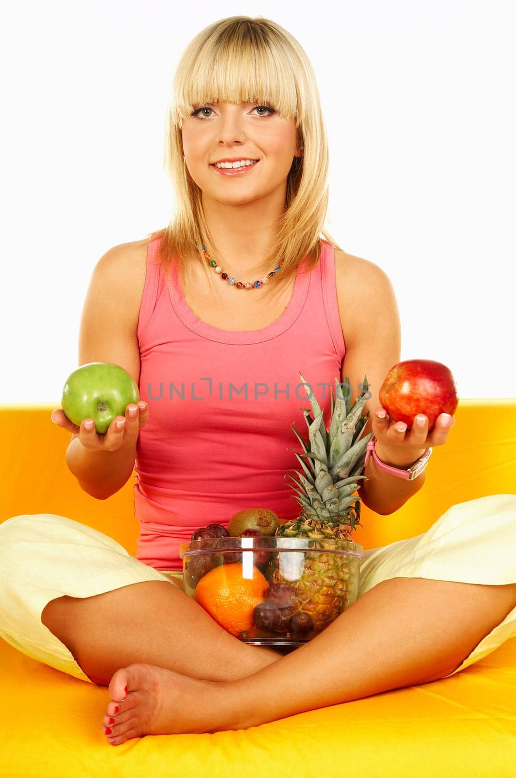 Happy beautiful women with fresh fruits