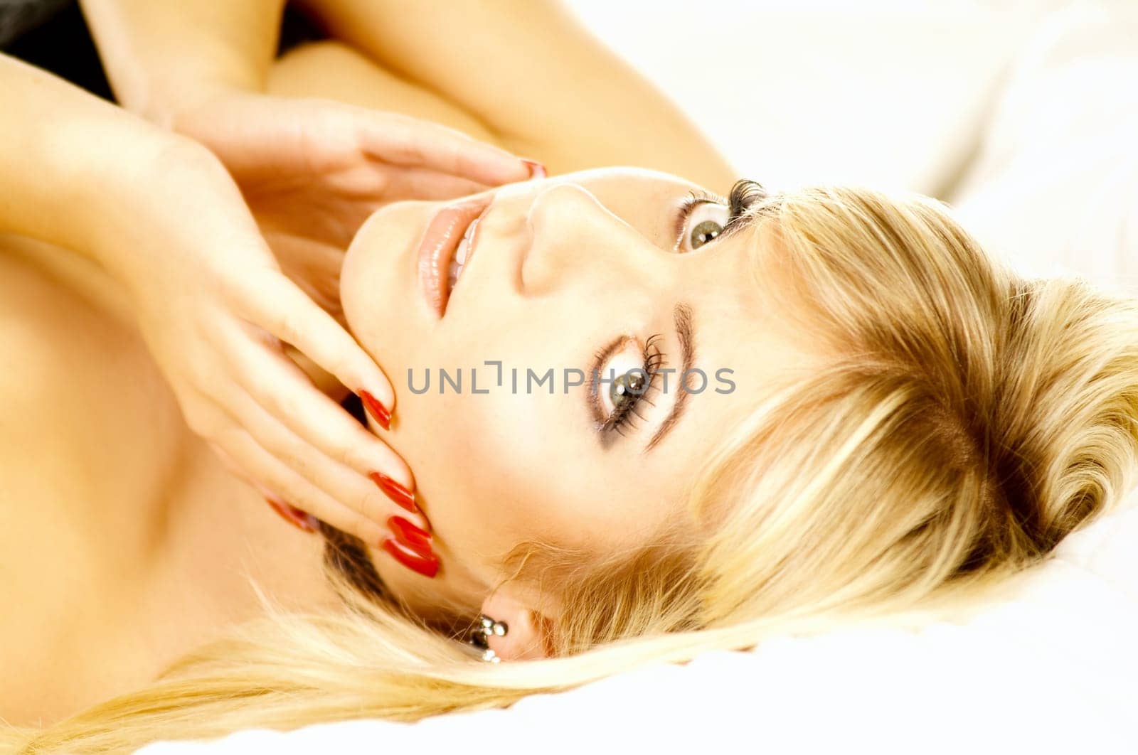 Portrait of attractive beautiful young woman on bed