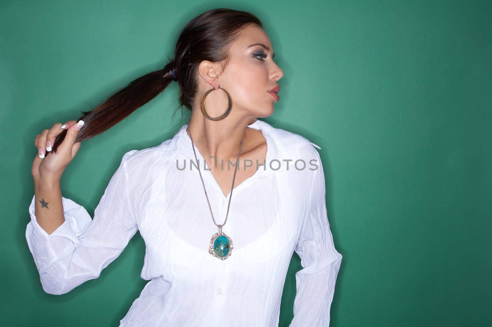 Portrait of Young woman isolated on green background
