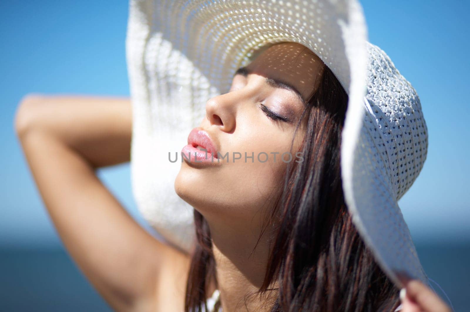 20-25 years old Beautiful Woman on the beach, wearing hat