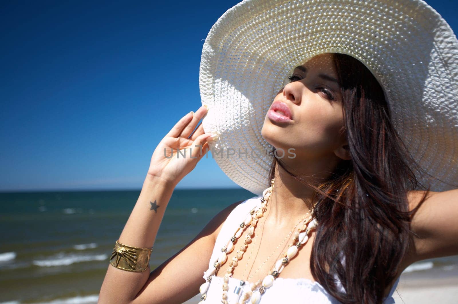 20-25 years old Beautiful Woman on the beach, wearing hat