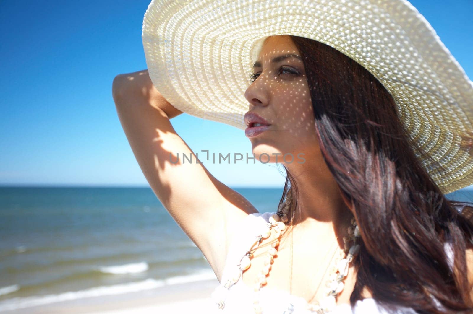 20-25 years old Beautiful Woman on the beach, wearing hat