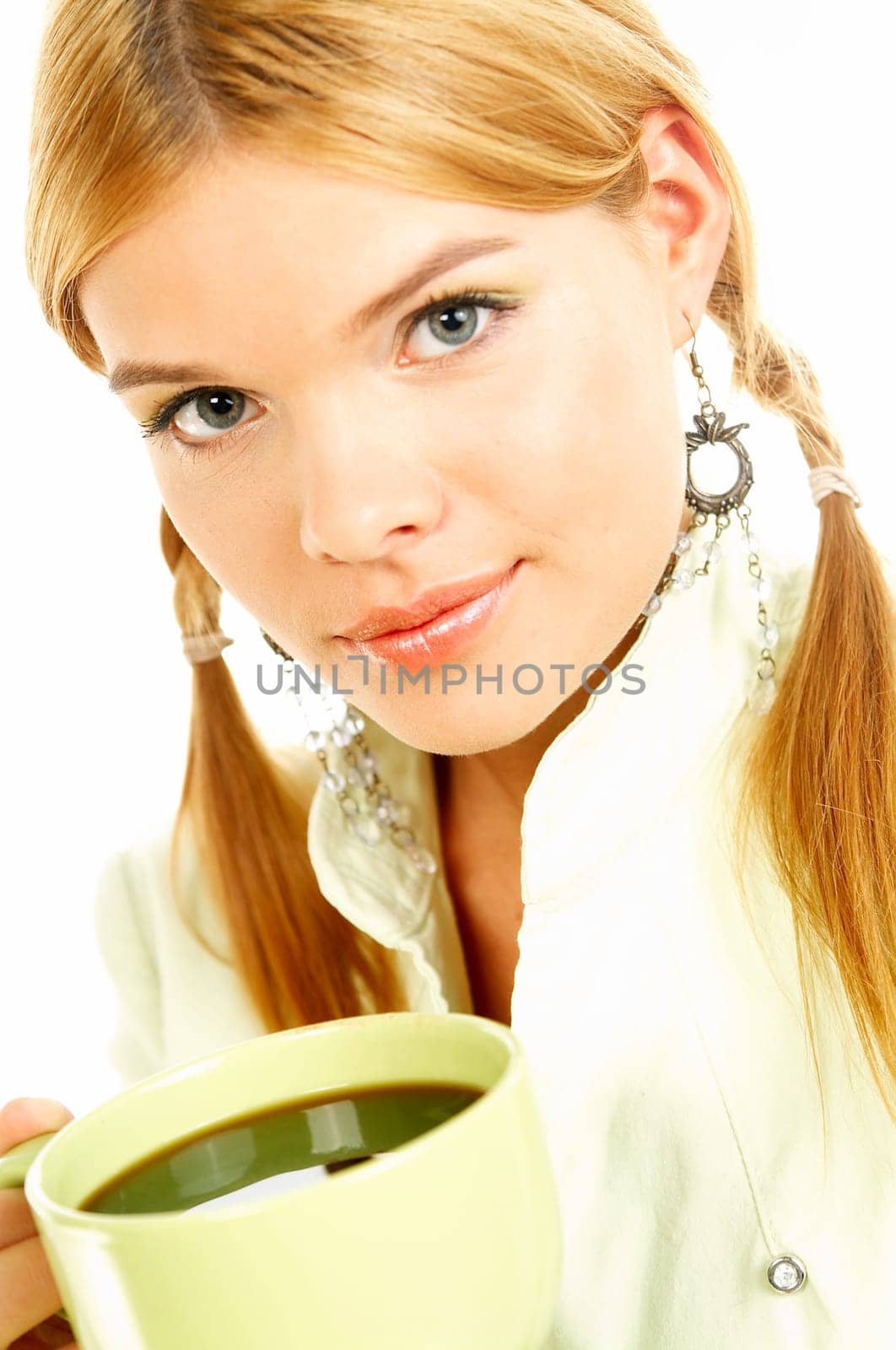 Portrait of attractive beautiful young woman with green cup od black coffee