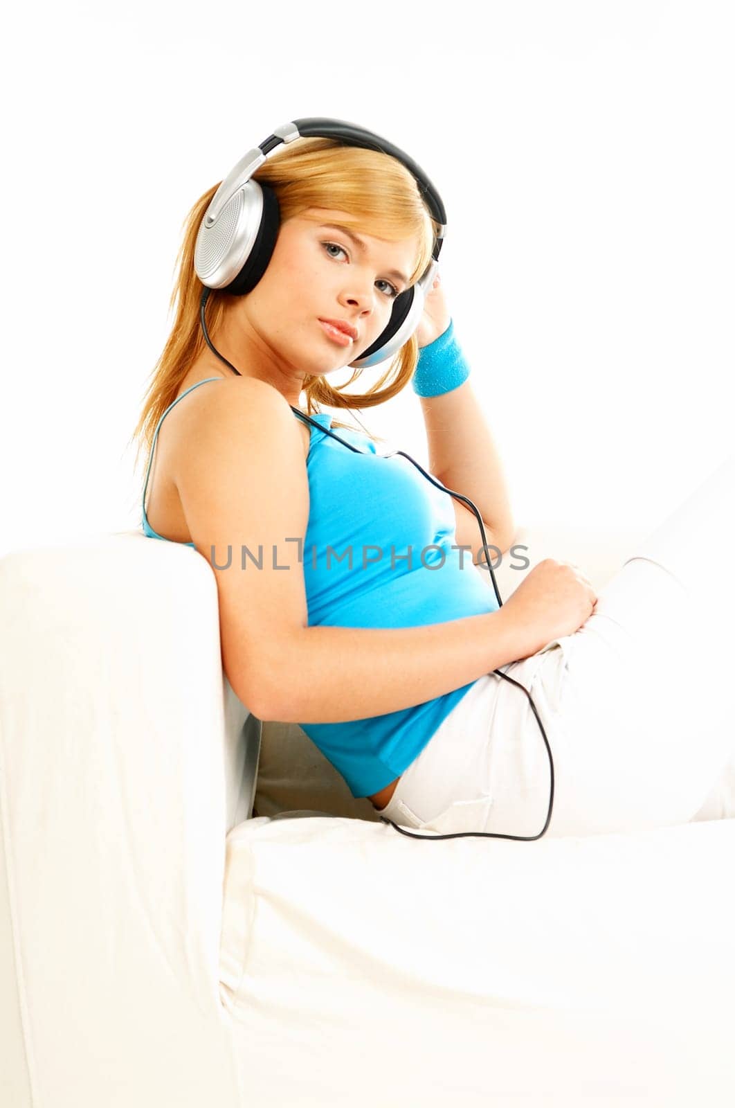 Young beautiful happy women listening music in headphones