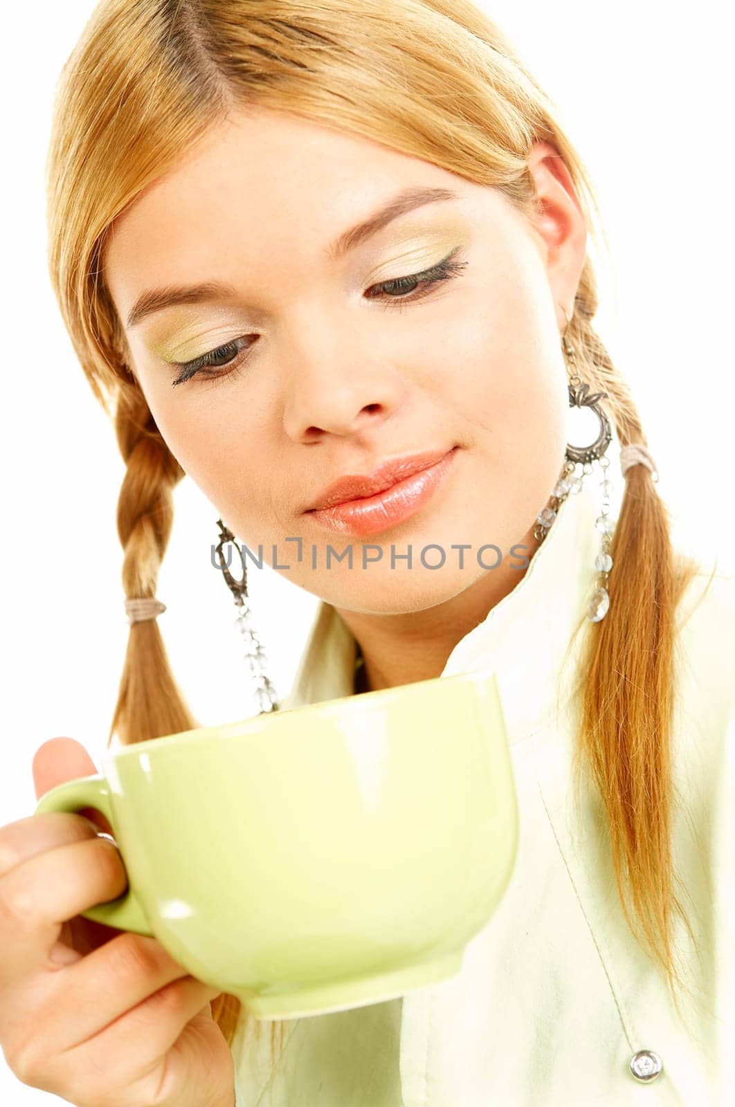 Portrait of attractive beautiful young woman with green cup od black coffee