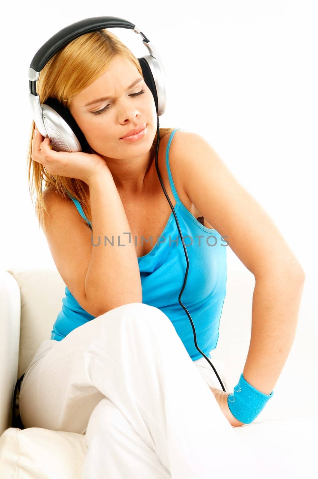 Young beautiful happy women listening music in headphones
