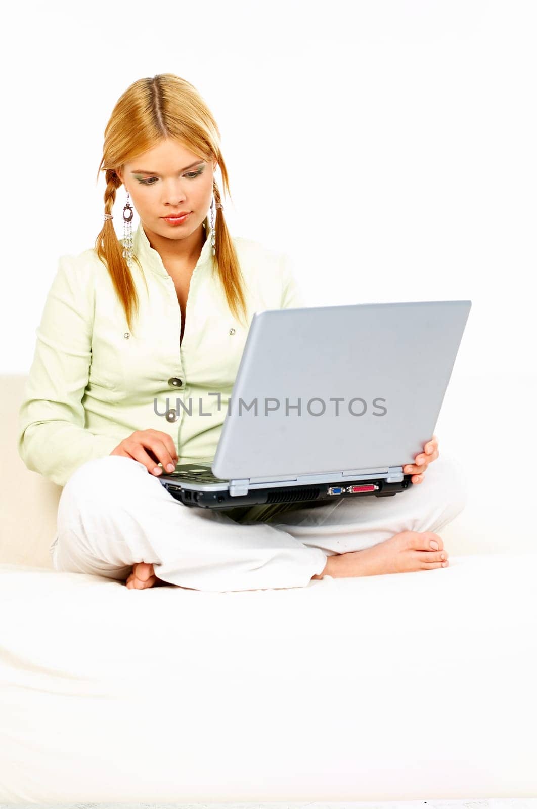 Sexy blonde busiess woman using laptop computer