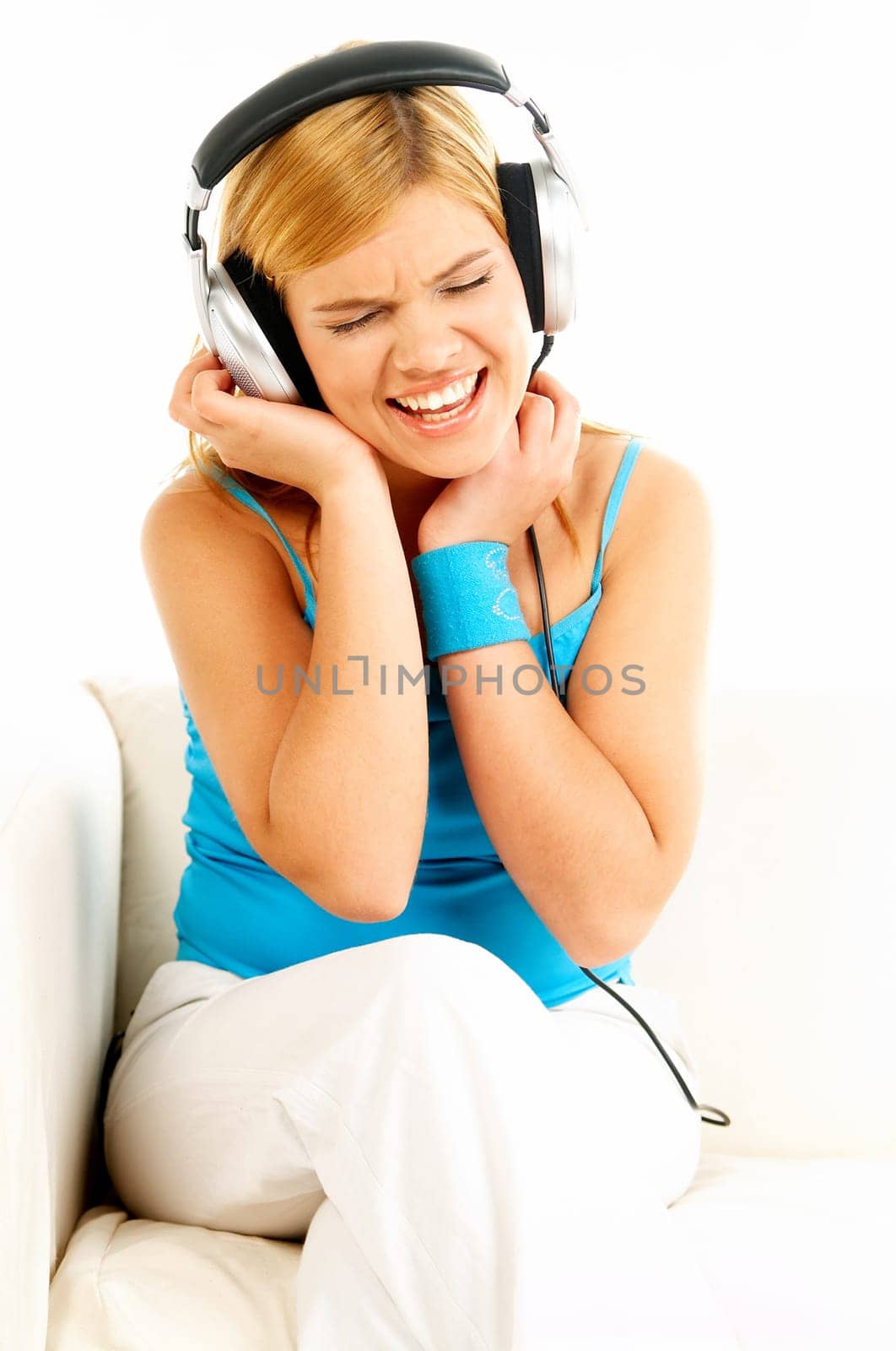 Young beautiful happy women listening music in headphones