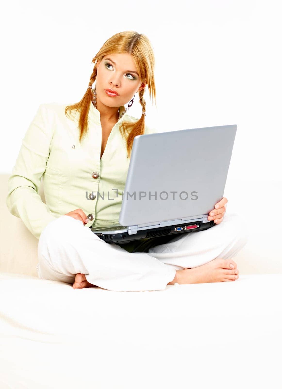 Sexy blonde busiess woman using laptop computer