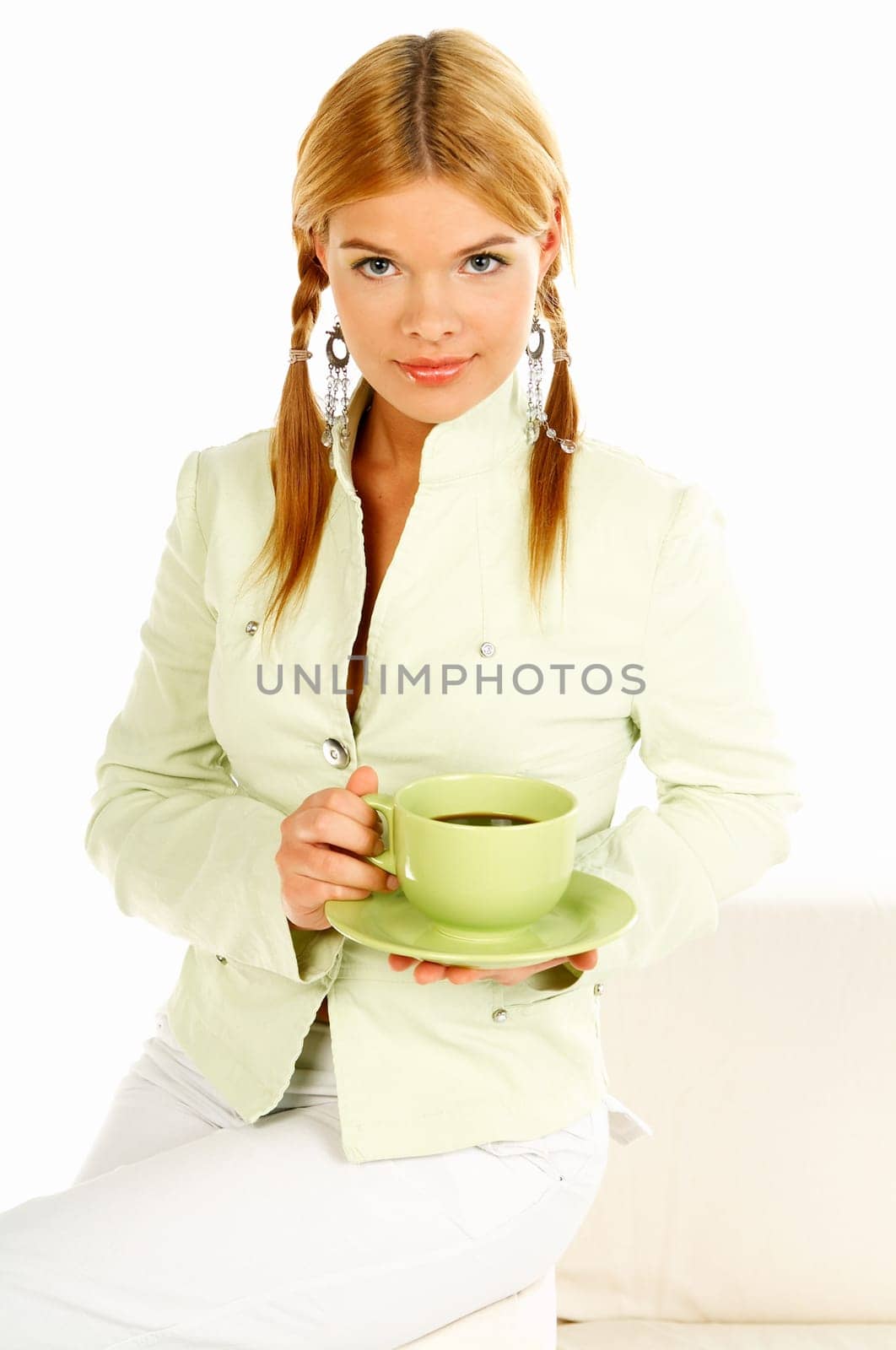 Portrait of attractive beautiful young woman with green cup od black coffee