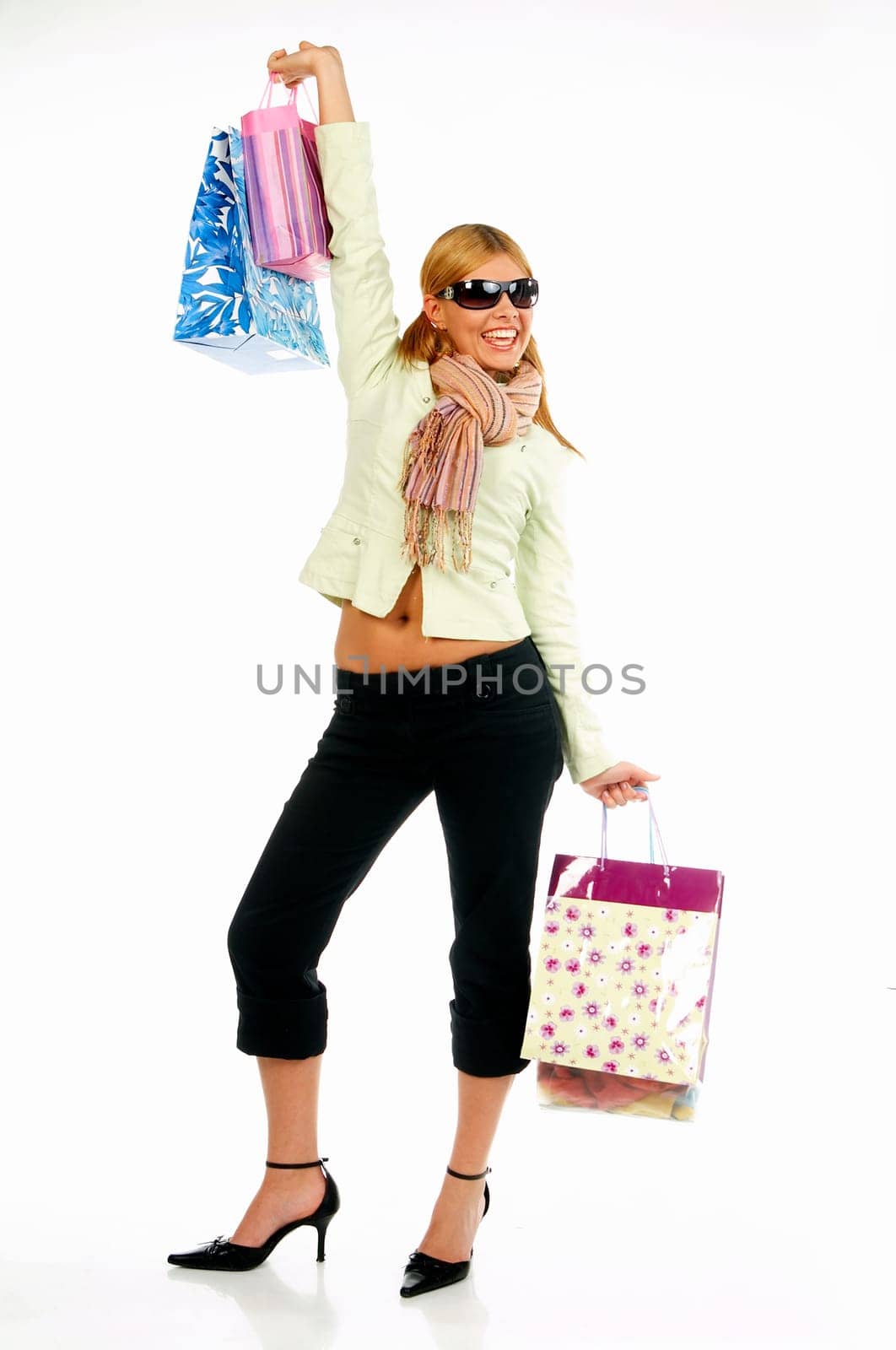 Blonde sexy girl with hands full of bags
