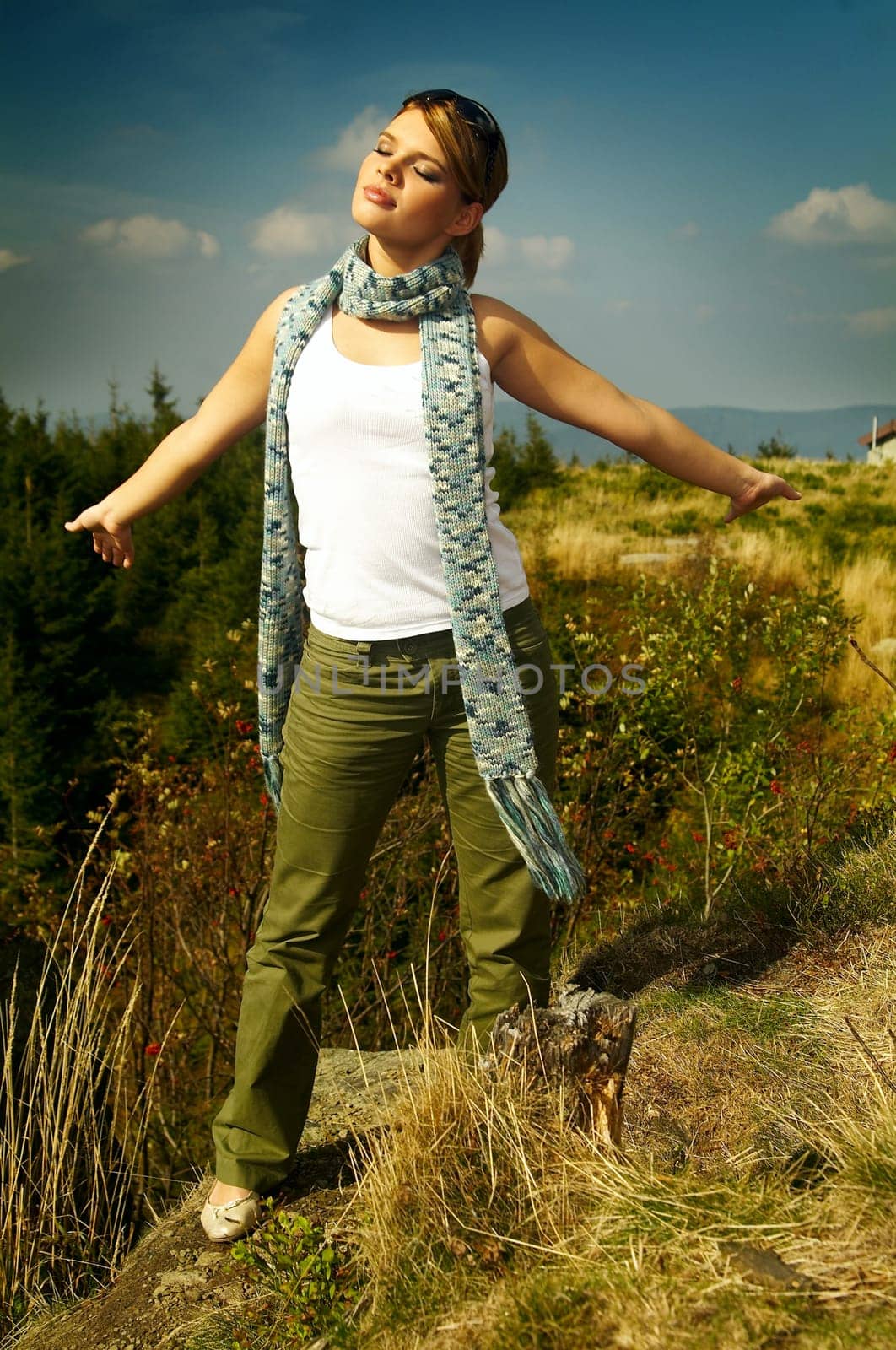 Young business woman relaxing on mountains outdoors