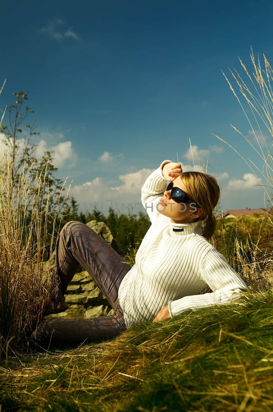 Young beautiful model posing in mountain outdoor scenery